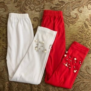 Red and white leggings with beading on the bottom